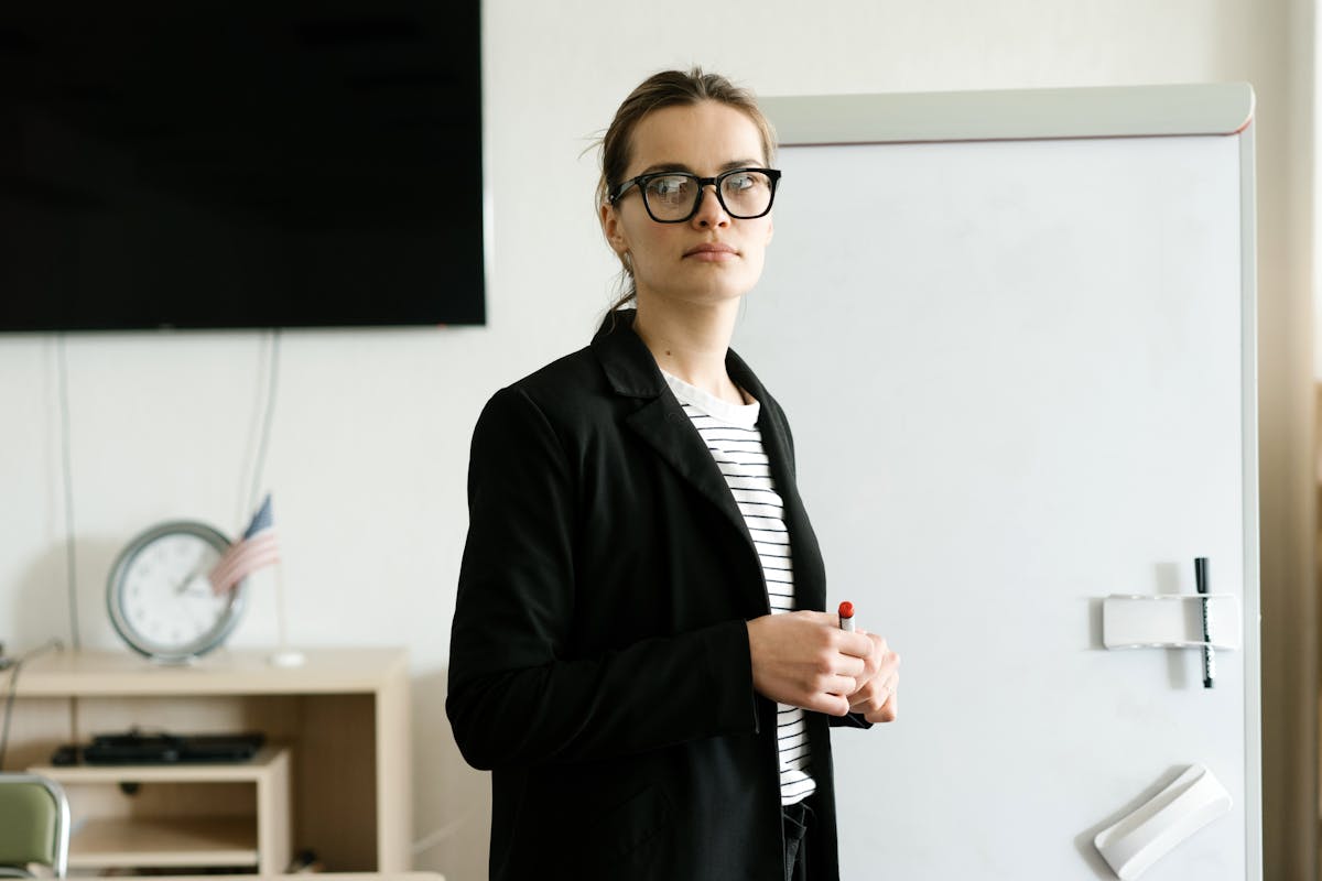 Professional instructor leading a business workshop with presentation screen